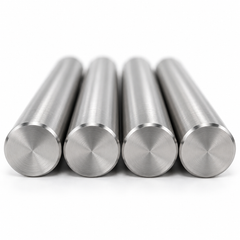 Close-up of four precision-ground mold return pin faces
