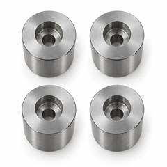 Top view of four S45C mold stop posts with counterbores