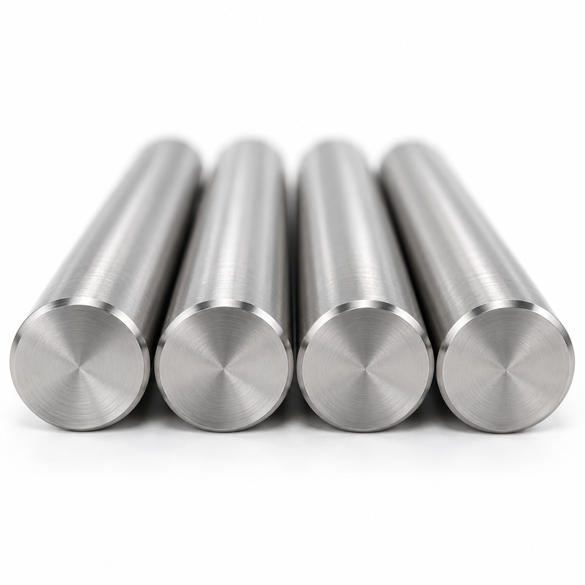Close-up of four precision-ground mold return pin faces